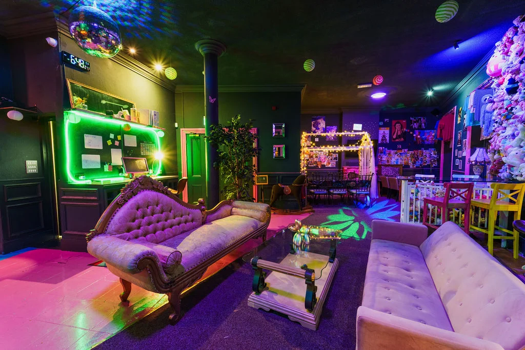 Neon lounge area with disco ball at The Mad House Pink Lane Newcastle